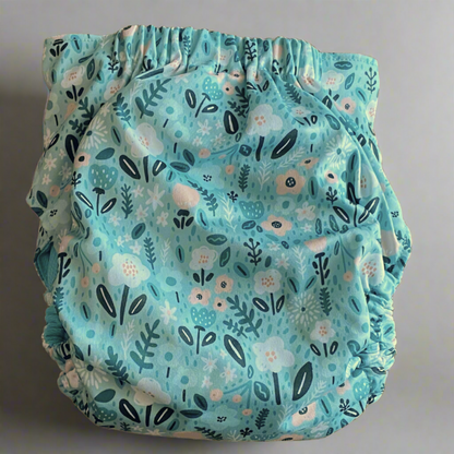 TODDLER (18-55lbs) 3D Gusset Pocket™ Cloth Diaper in TEAL FLOWERS