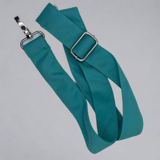 blue-green teal shoulder strap with   silver metal attachments